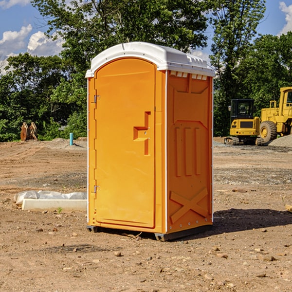 what is the cost difference between standard and deluxe portable toilet rentals in Bluejacket